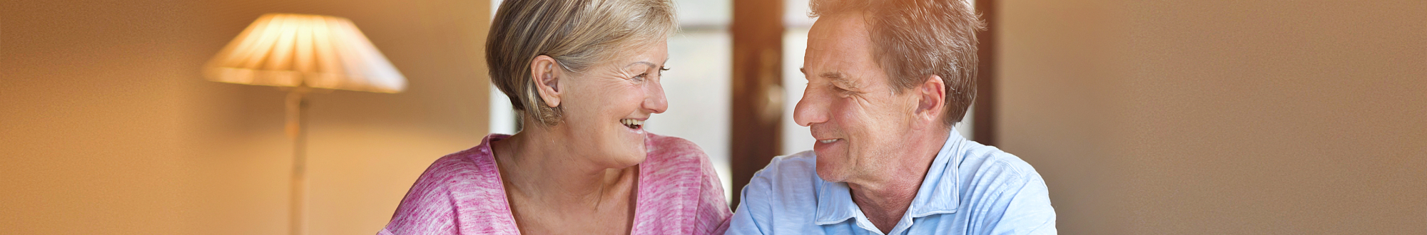 Senior couple smiling at each other