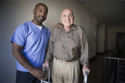 male healthcare worker with elder man