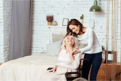 caregiver and senior smiling